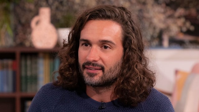 Joe Wicks in a navy jumper looking sombre