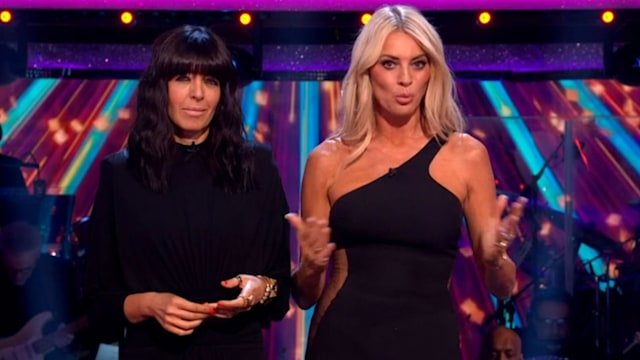 Claudia Winkleman wearing a black dress as she hosts Strictly with Tess Daly