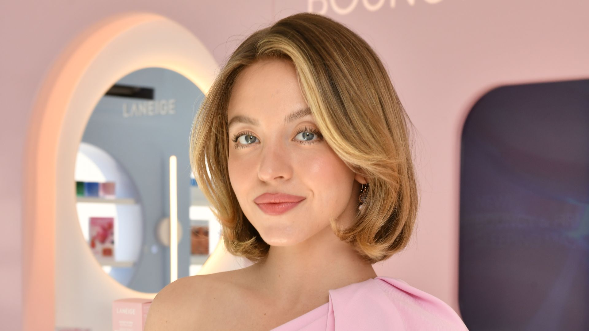 Sydney Sweeney visits the LANEIGE Pop-Up at The Grove LA in a pink jumpsuit 