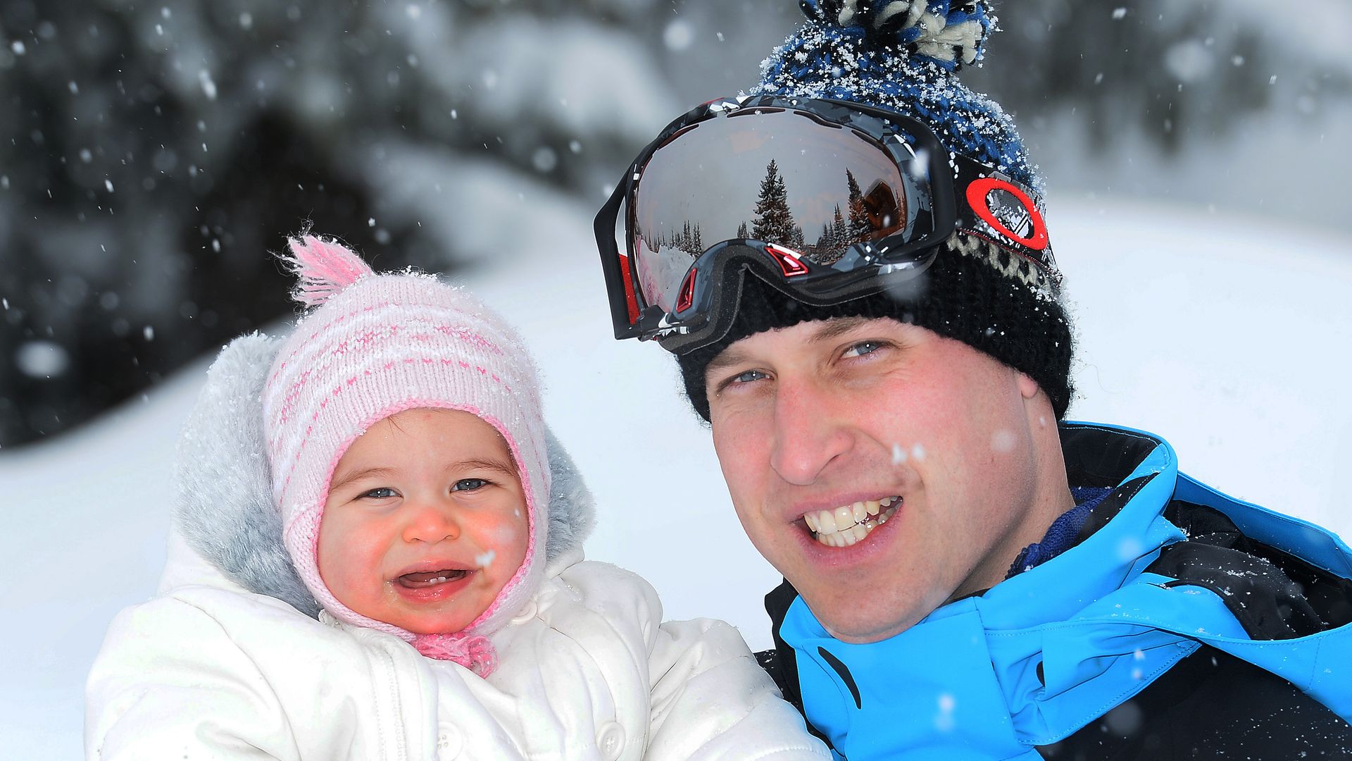 father with baby daughter in snow