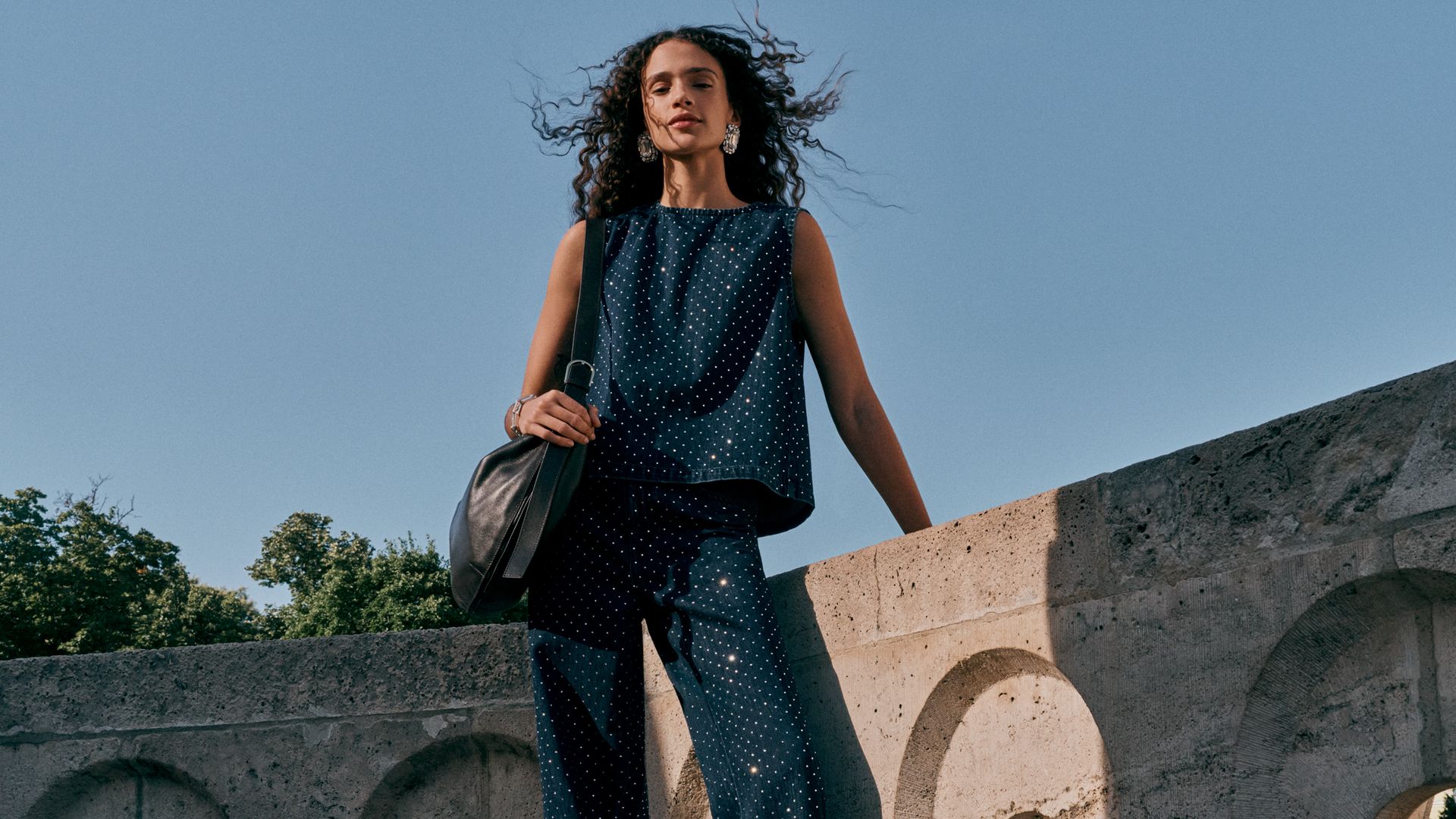 model in sparkly denim set