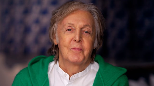 photo of paul mccartney in green hoodie