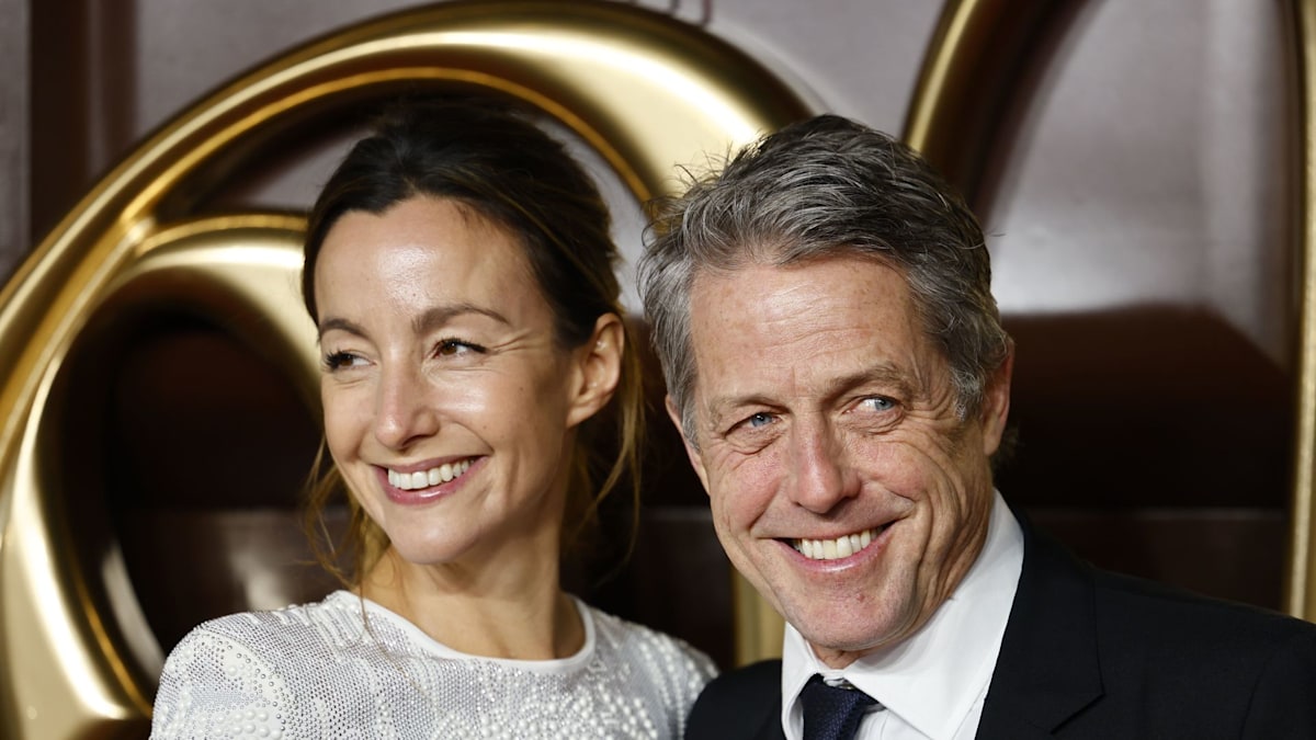 Hugh Grant and wife Anna Eberstein look smitten for rare red carpet appearance