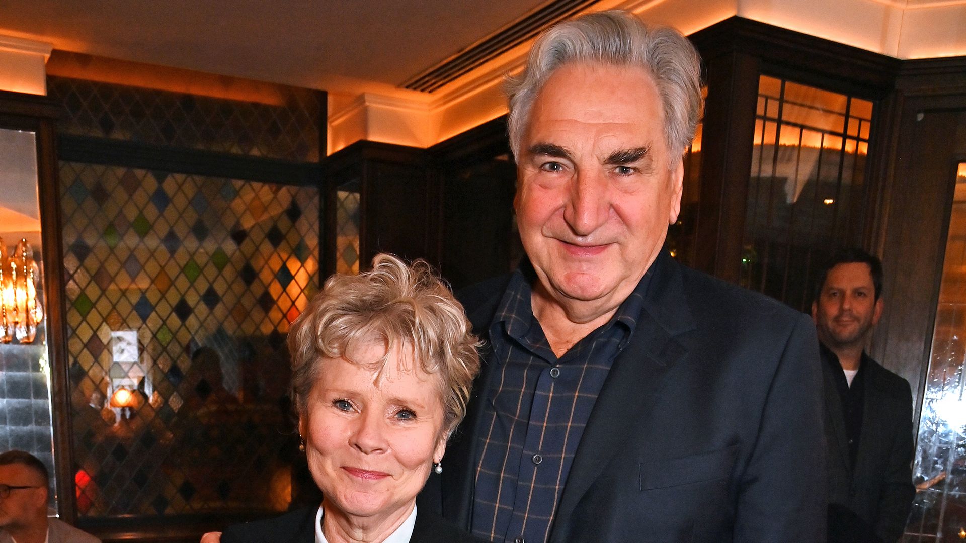 Jim Carter and Imelda Staunton cuddle up at the One Night Only event at The Ivy West Street