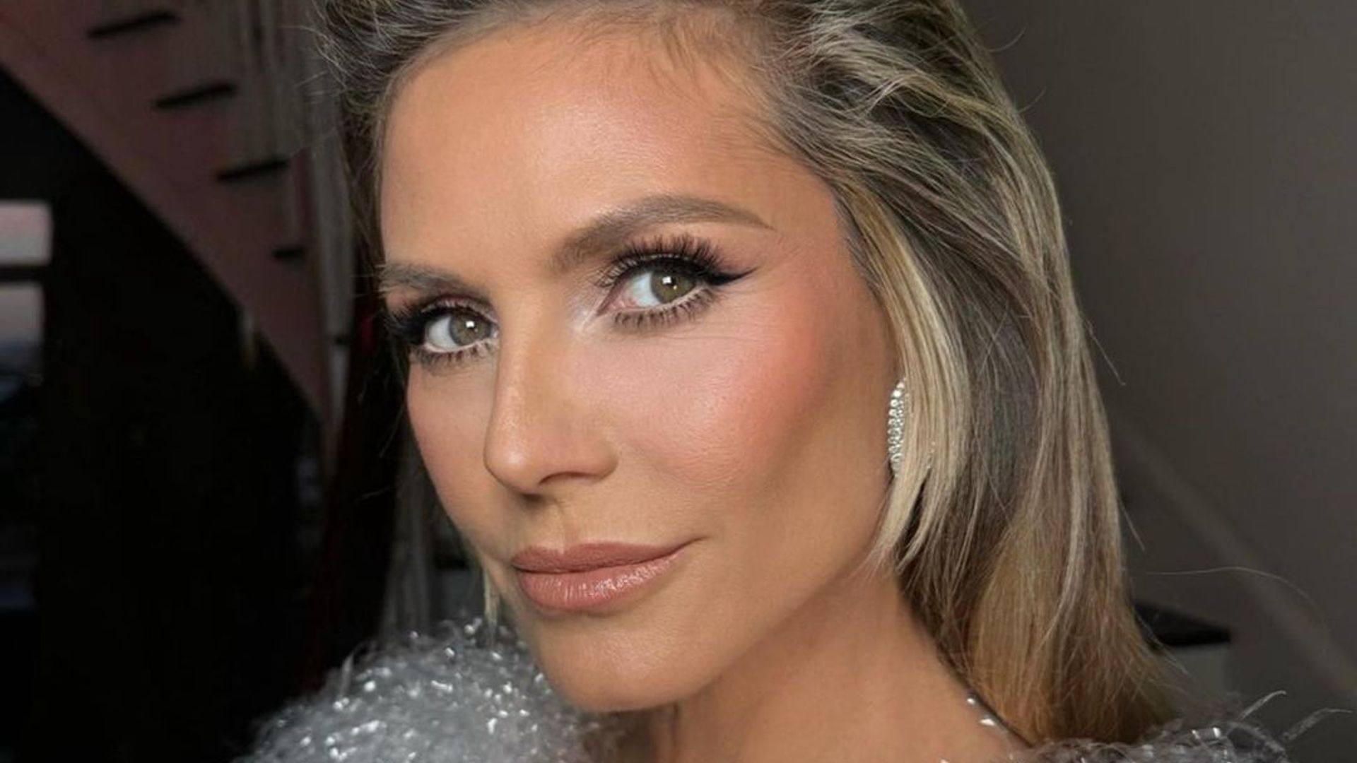 Heidi Klum beauty close up with glamorous makeup and hair transformation 