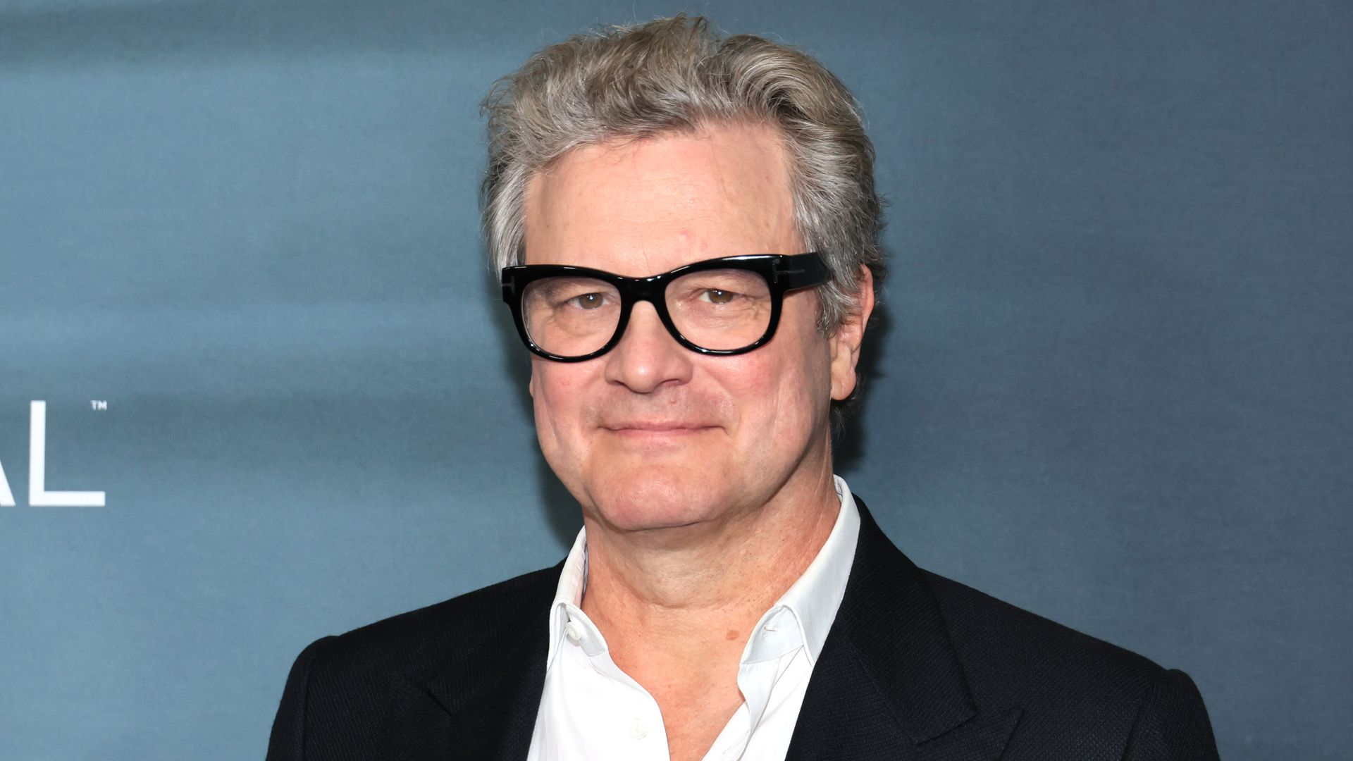 close-up actor wearing glasses and suit