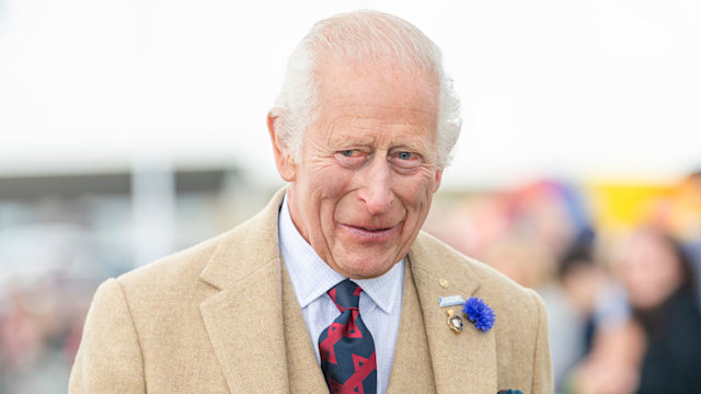 King Charles in a tan coat