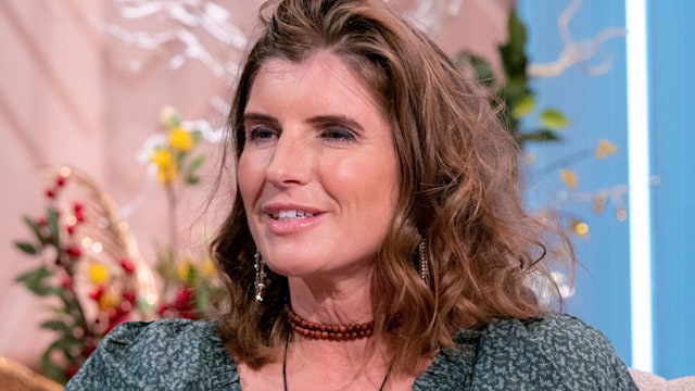 Amanda Owen in a green dress and a choker