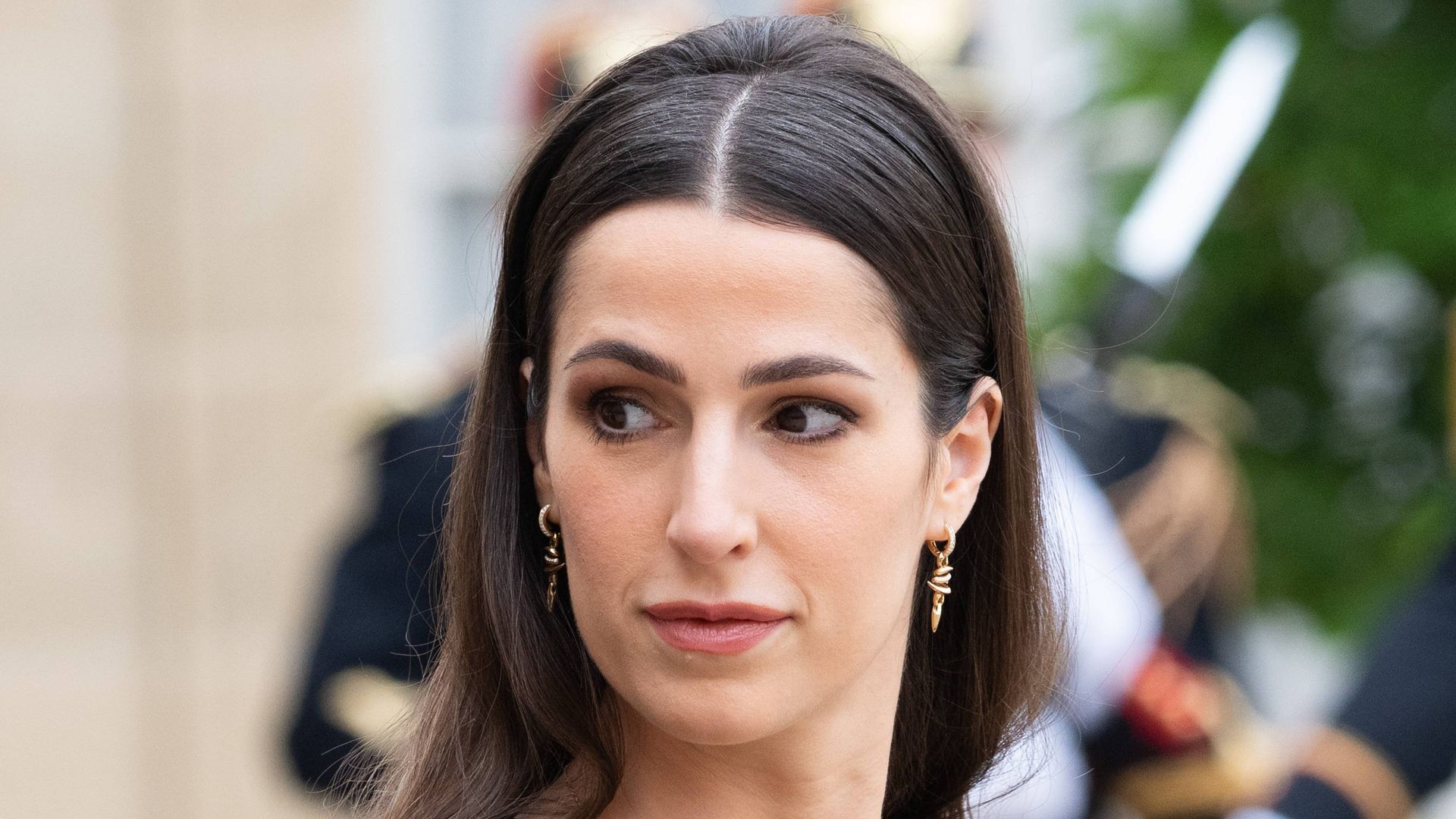 Princess Rajwa Al Hussein in black outfit exiting car