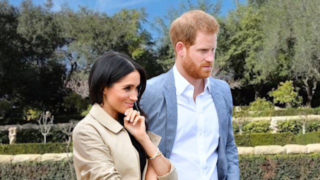 harry and meghan looking to the side