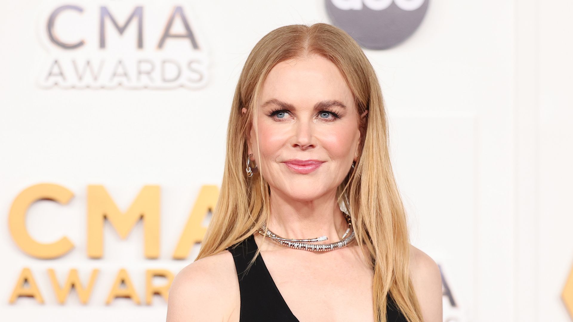 Nicole Kidman opts for chic waistcinching coat dress for starstudded