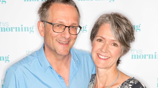 Michael Mosley in a blue shirt and Clare in a silver dress