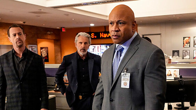 four men standing in ncis hq
