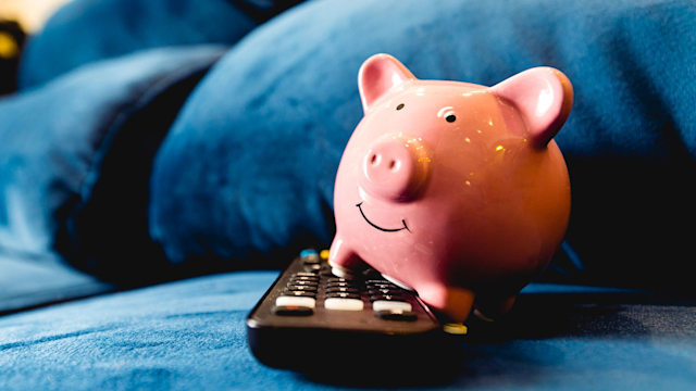 A piggy bank with a remote control