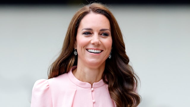 Kate Middleton smiling in pink dress