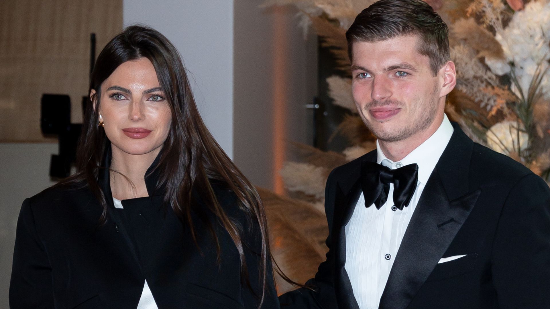 Kelly Piquet in a white dress and Max Verstappen in a tuxe