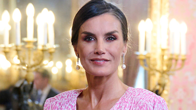 Queen Letizia of Spain wearing a pink dress as she attends a luncheon for world literature members in 2023