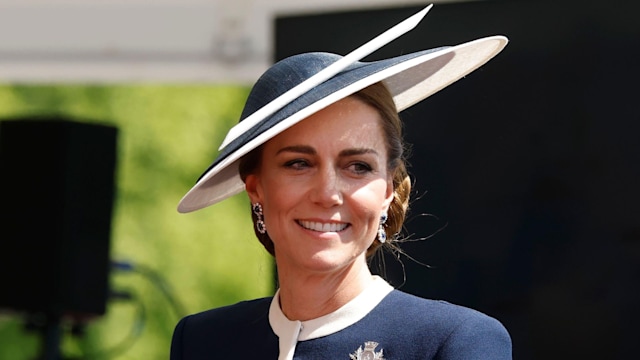 The Princess of Wales in navy hat and dress