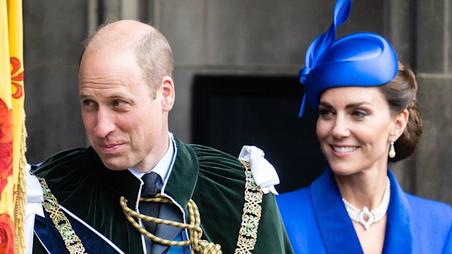 Princess Kate and Prince William in formal attire smiling and looking bashful
