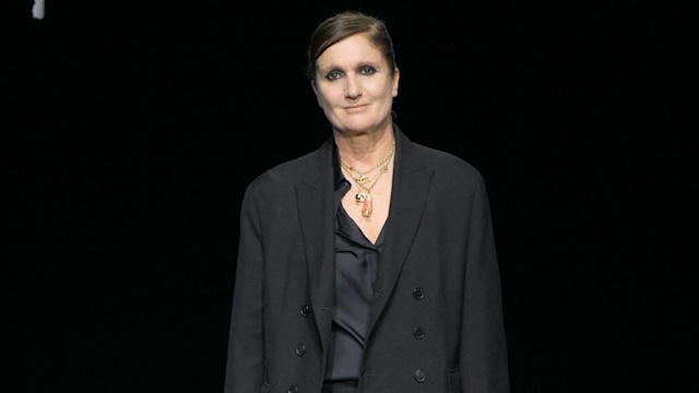 Maria Grazia Chiuri  in black outfit on runway