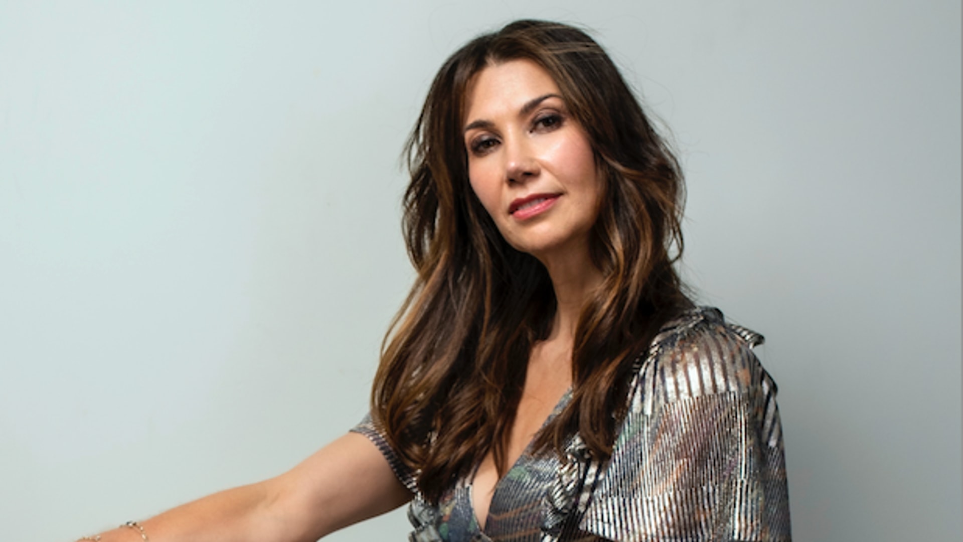 Woman in glitzy silver dress