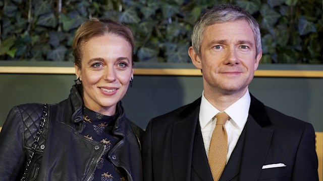 woman and man posing for photo