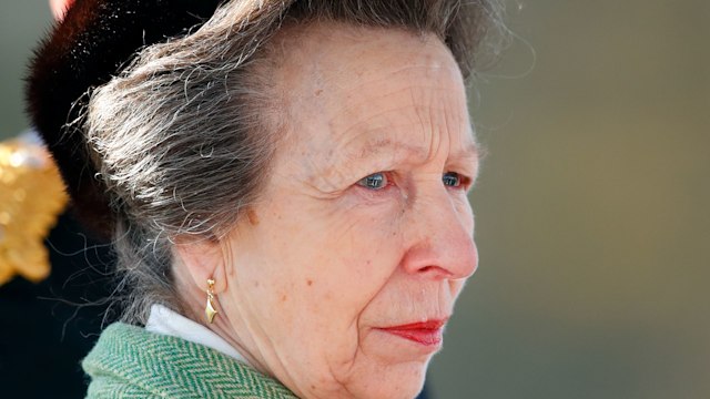 Princess Anne looking sad at Sovereign's Parade in green coat