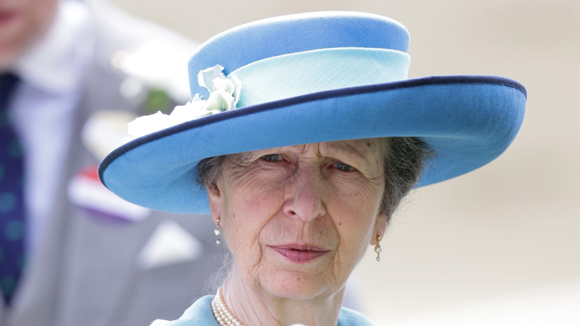 Princess Anne pointing wearing white gloves