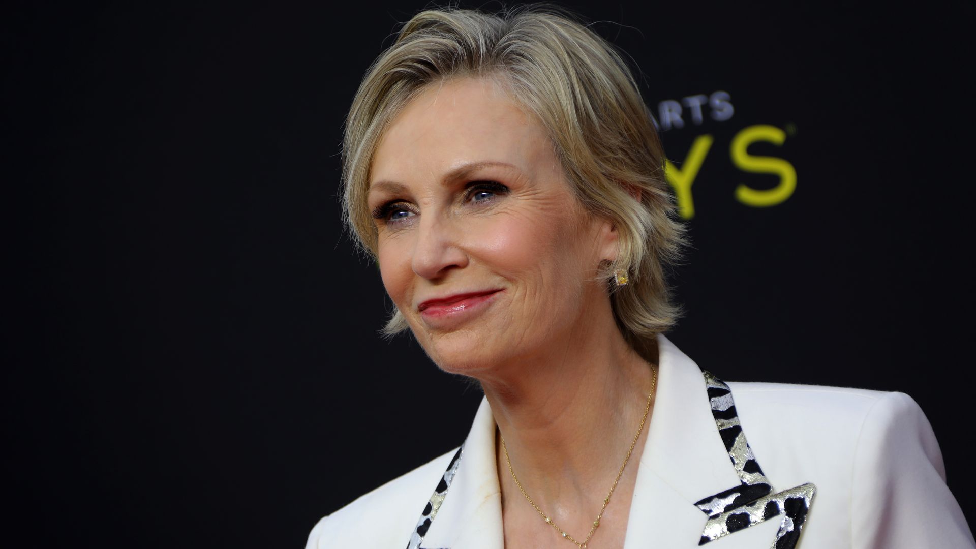 Jane Lynch at Emmys poses on the red carpet