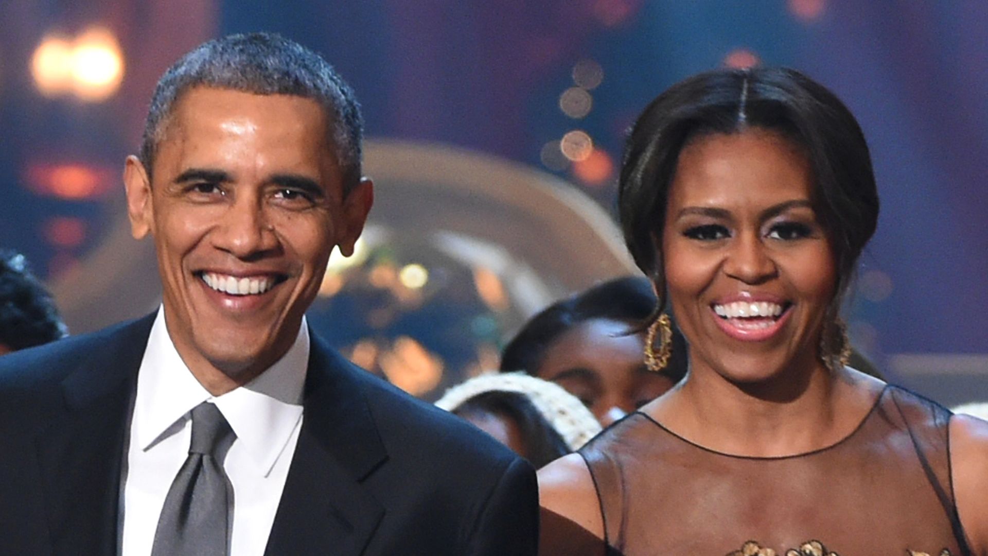 U.S. President Barack Obama and First Lady Michelle Obama speak onstage at TNT Christmas in Washington 2014 at the National Building Museum on December 14, 2014 in Washington, DC.