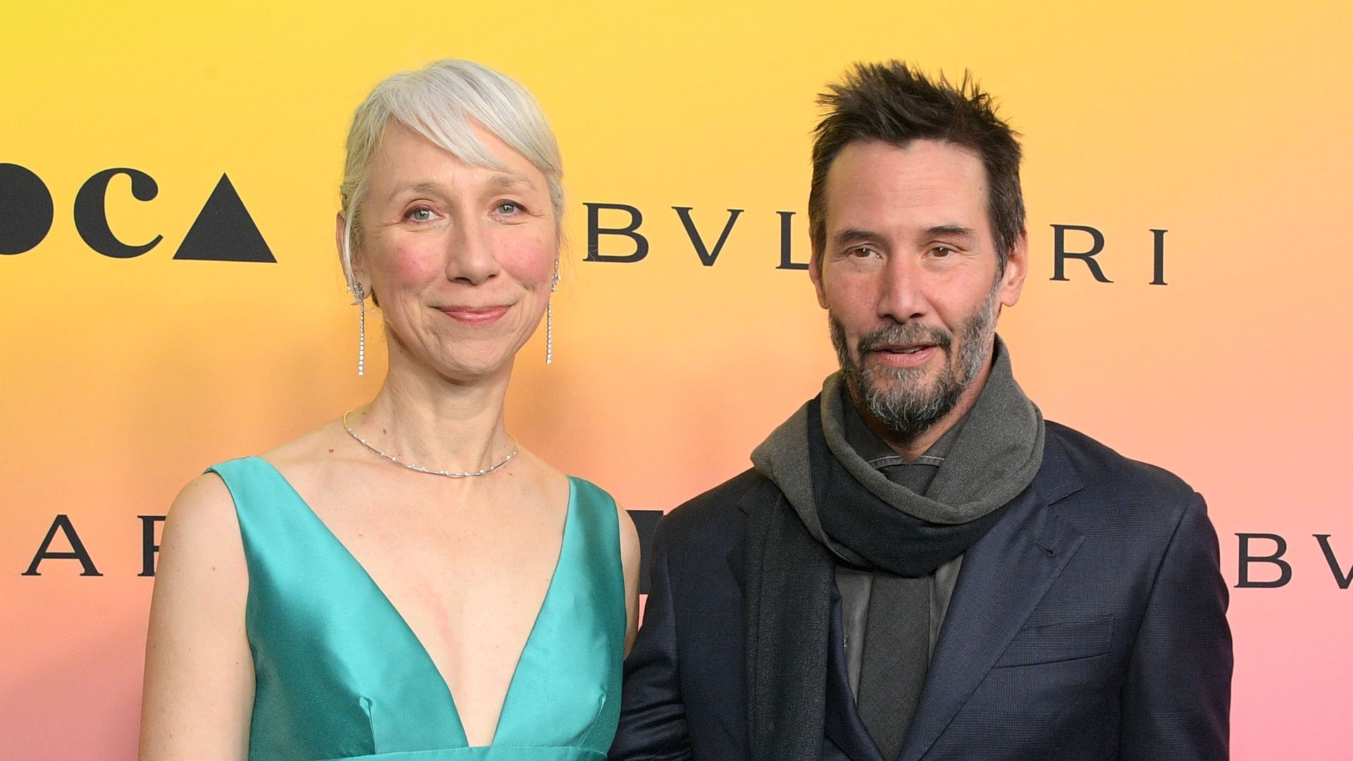 photo of keanu reeves and alexandra grant on red carpet