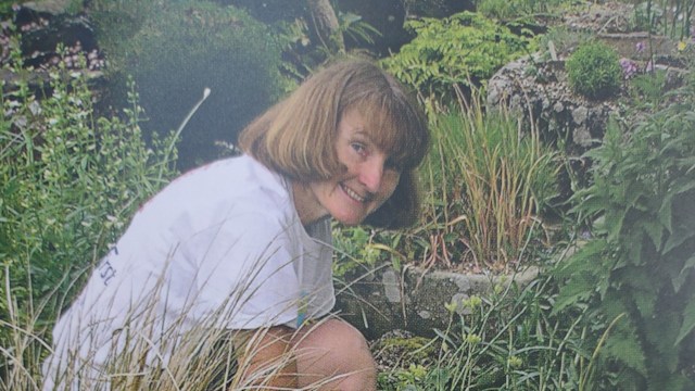 woman bending down gardening 