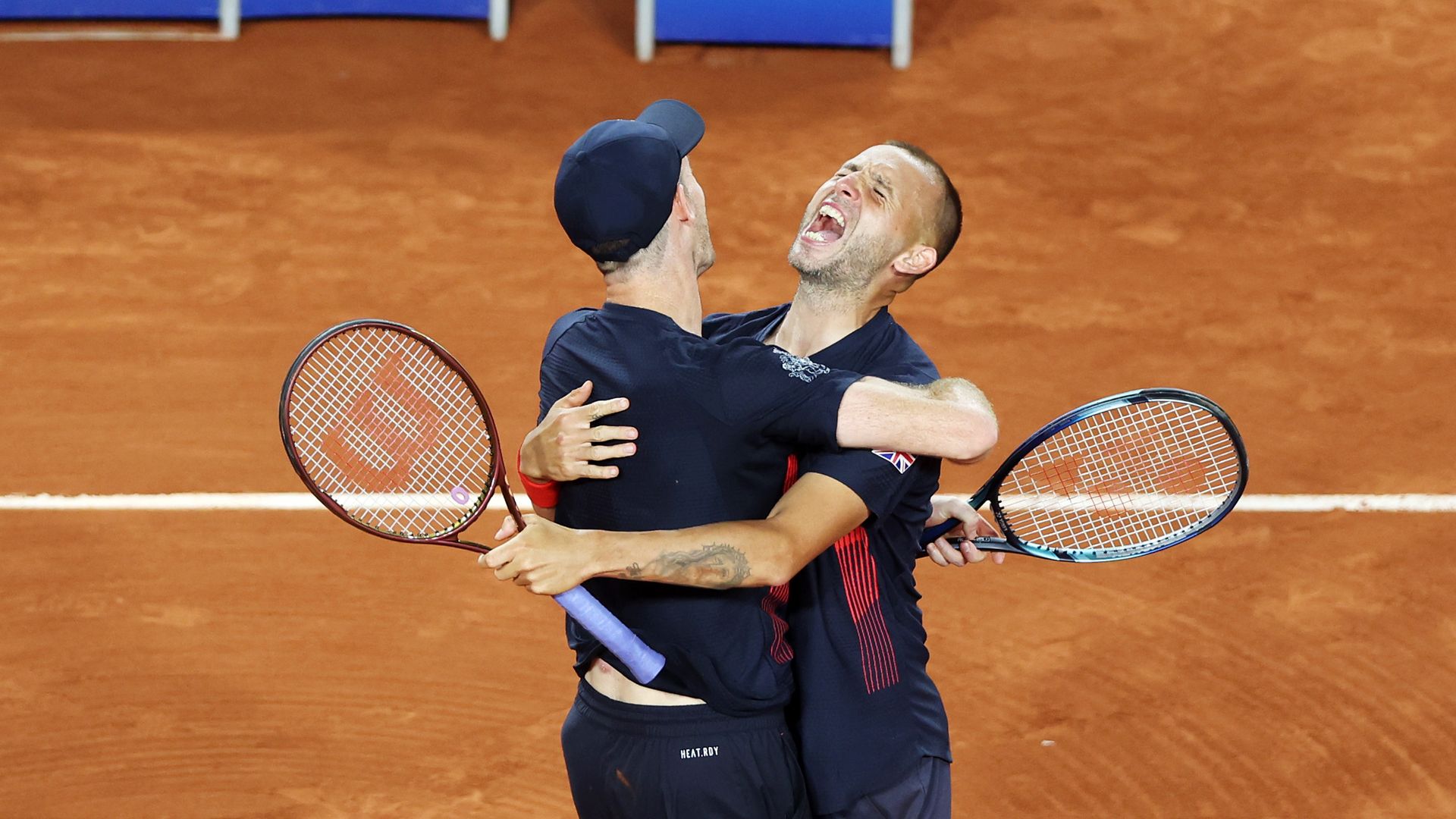 Dan Evans celebrates with Andy Murray