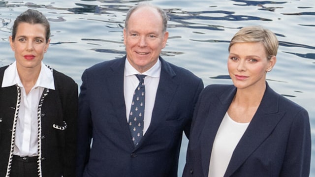 A captain stood with Charlotte Casiraghi, Prince Albert and Princess Charlene