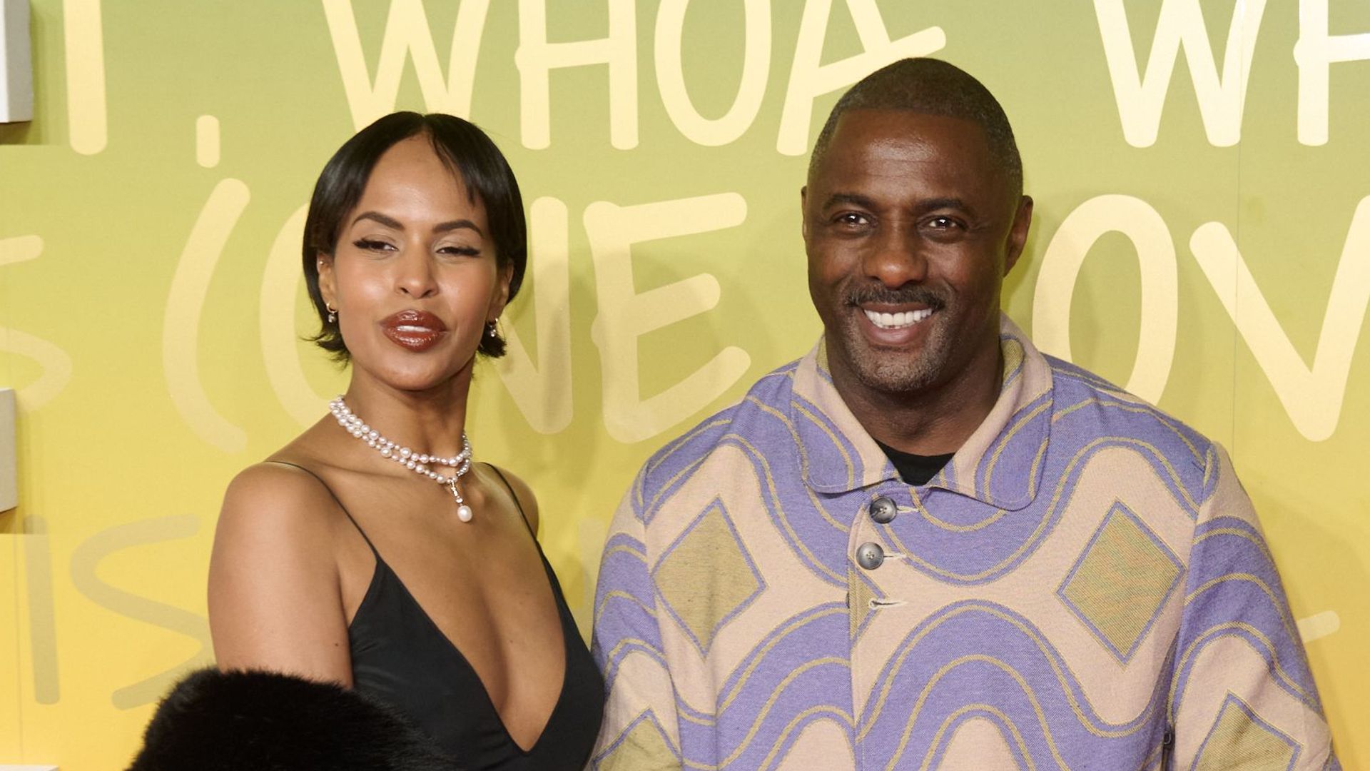 Idris Elba's wife Sabrina has a total Bond-girl moment in silhouette-skimming silky dress