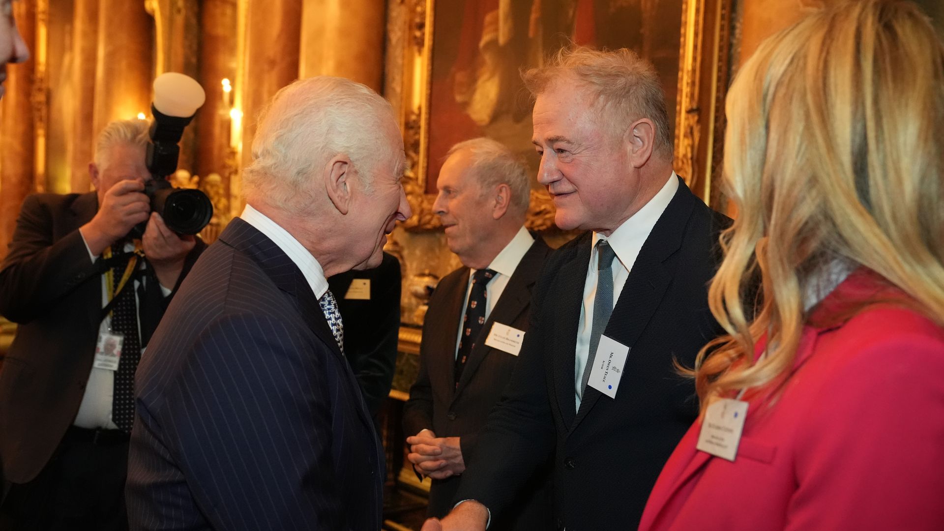 King Charles shaking hands with Owen Teale