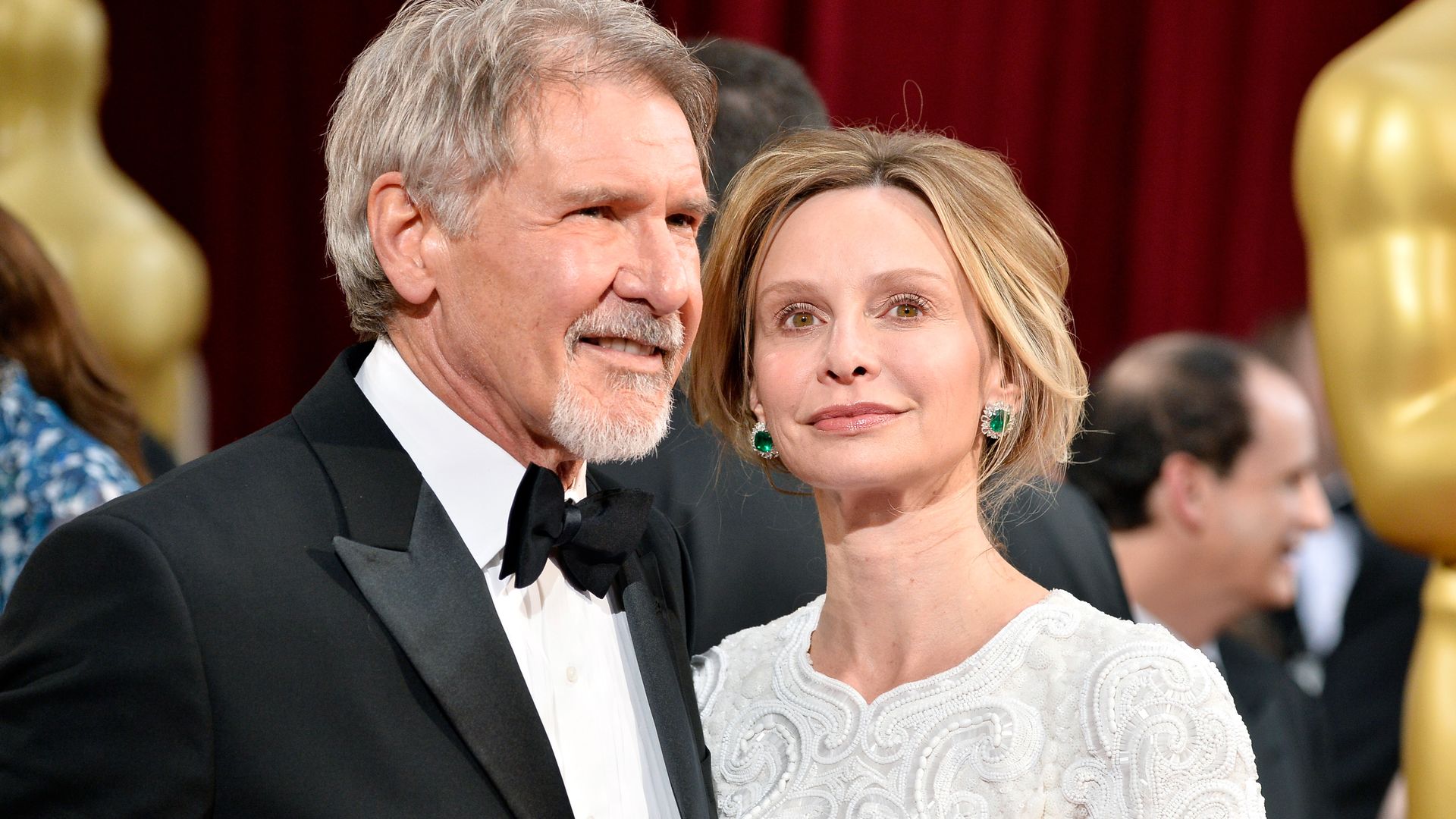 Harrison Ford and Calista Flockhart attend the Oscars in 2014