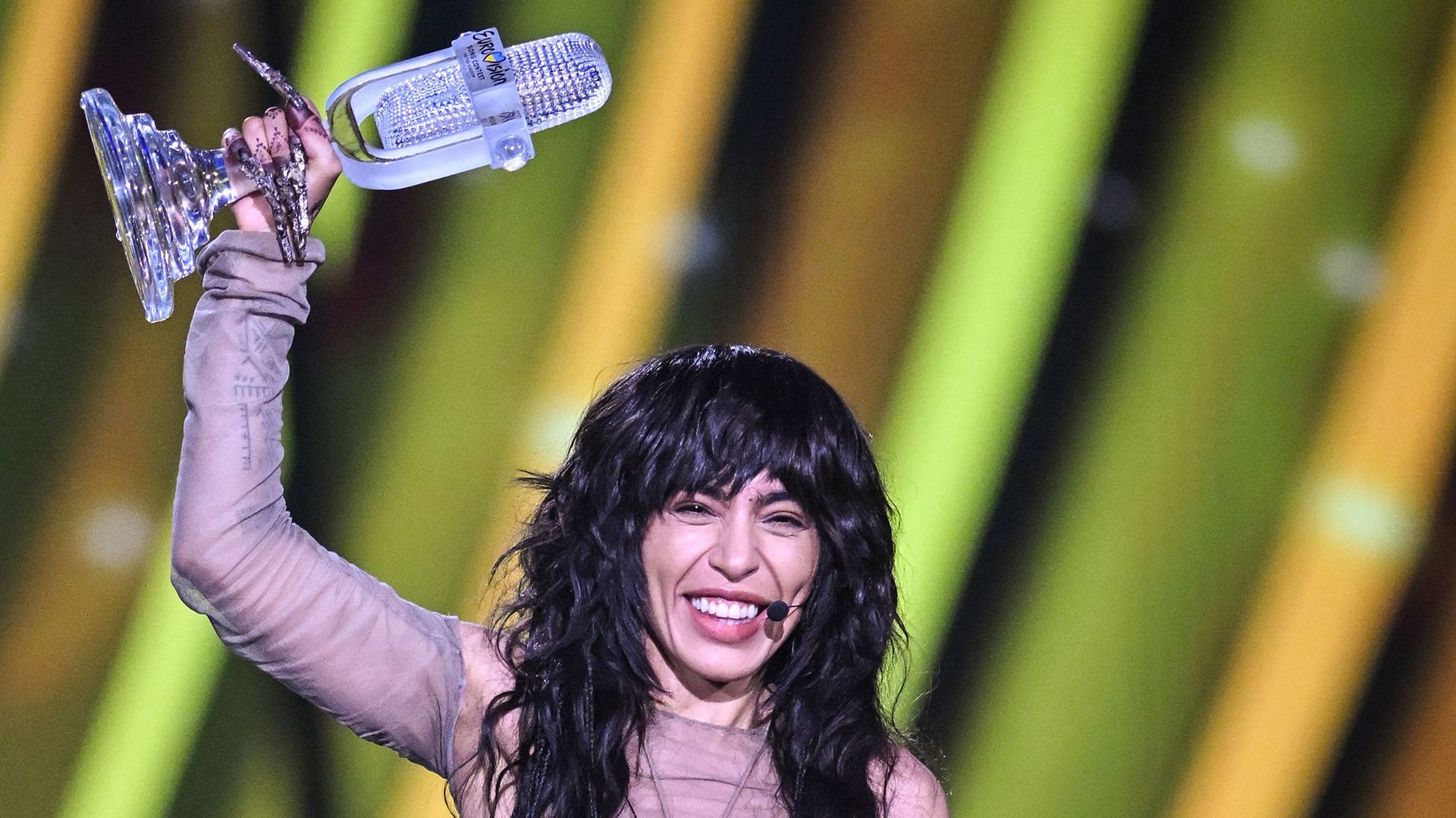 Loreen holding her Eurovision 2023 glass microphone 