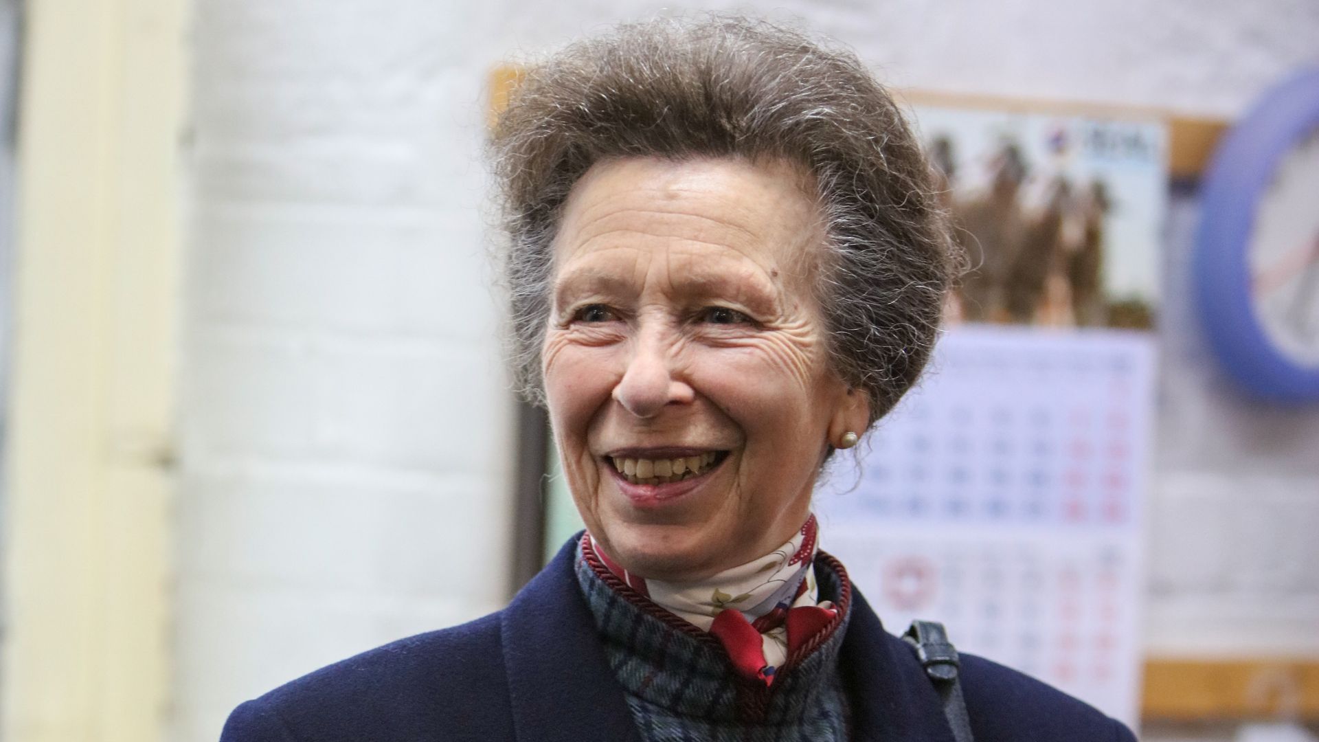 Princess Anne gives us autumnal vibes in tartan dress and leather boots