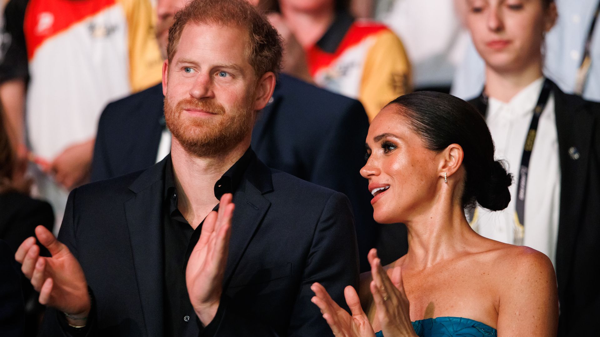Harry and Meghan clapping at Invictus Games 2023