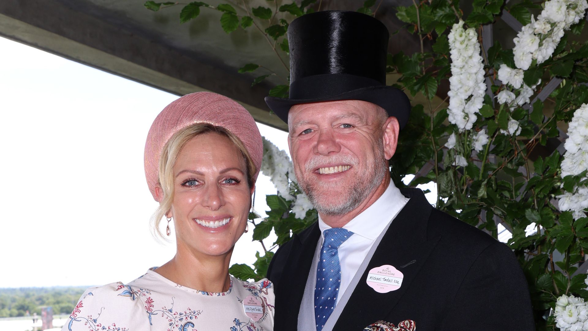 Zara Tindall in a floral dress with Mike Tindall in a black suit