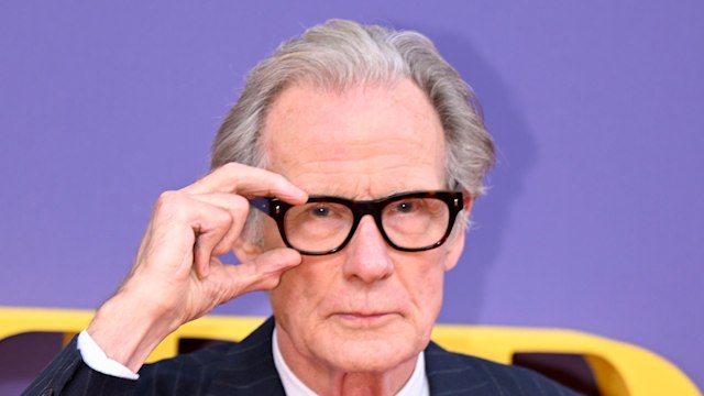 Bill Nighy with glasses and suit 