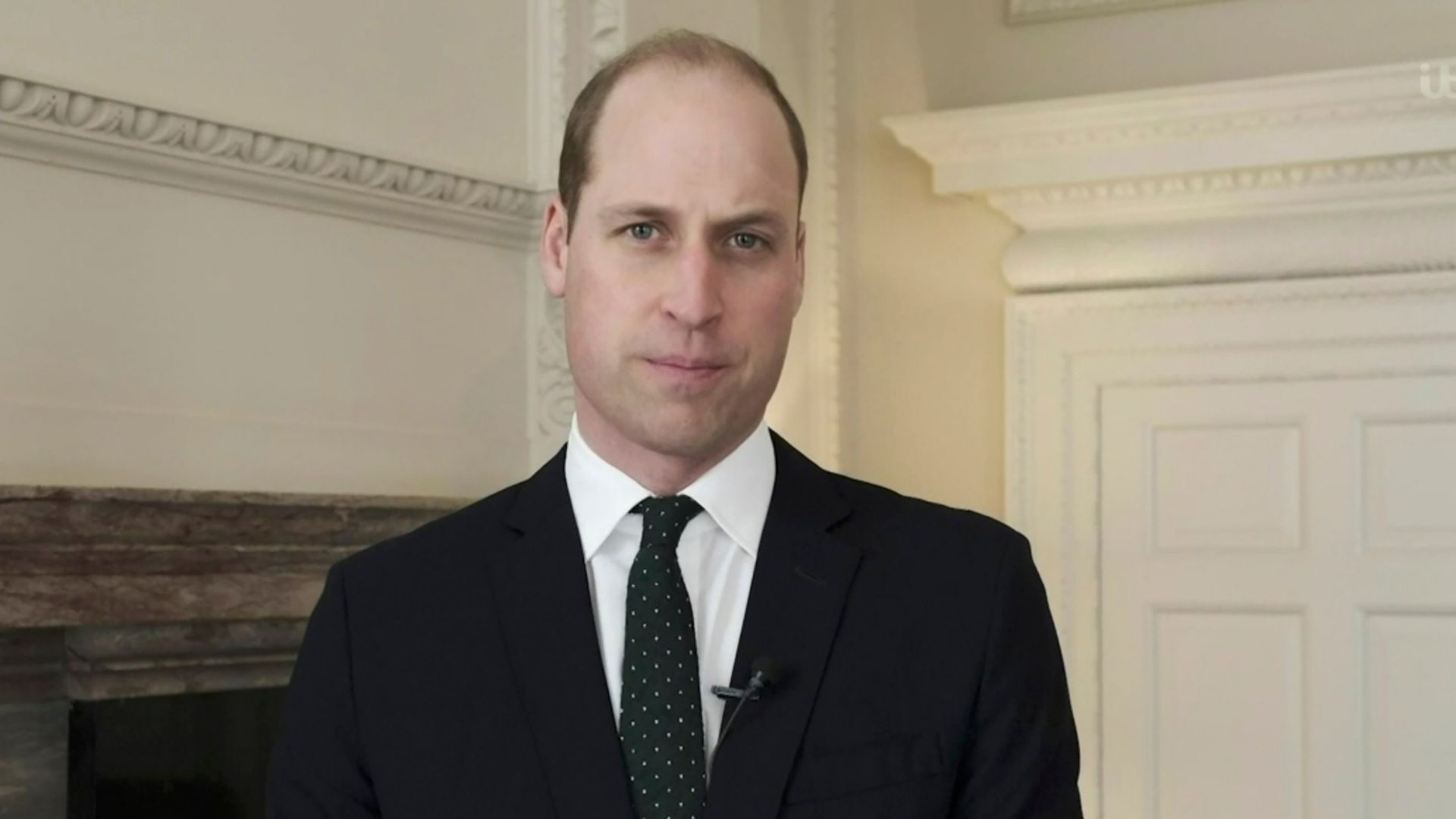 Prince William wearing a black suit as he speaks on Lorraine. 