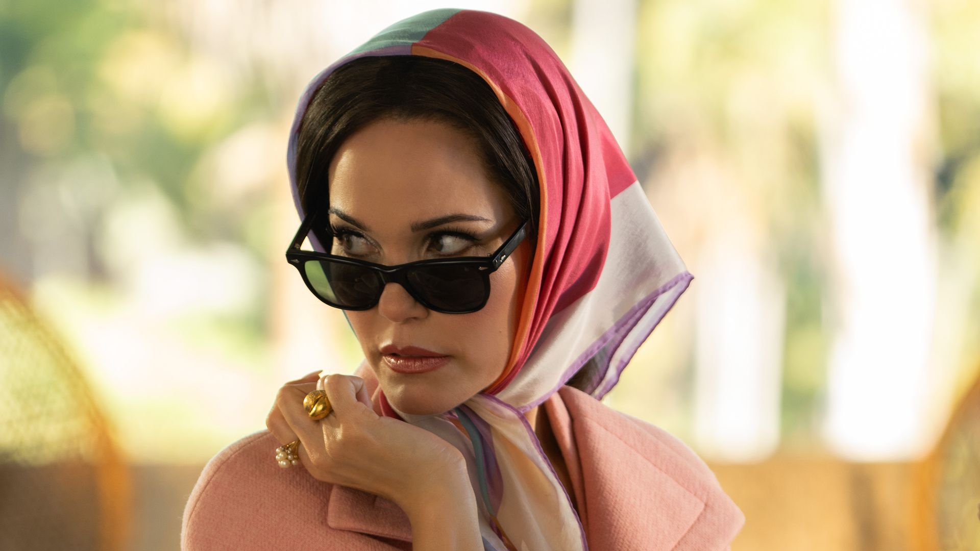 A woman wears a headscarf 