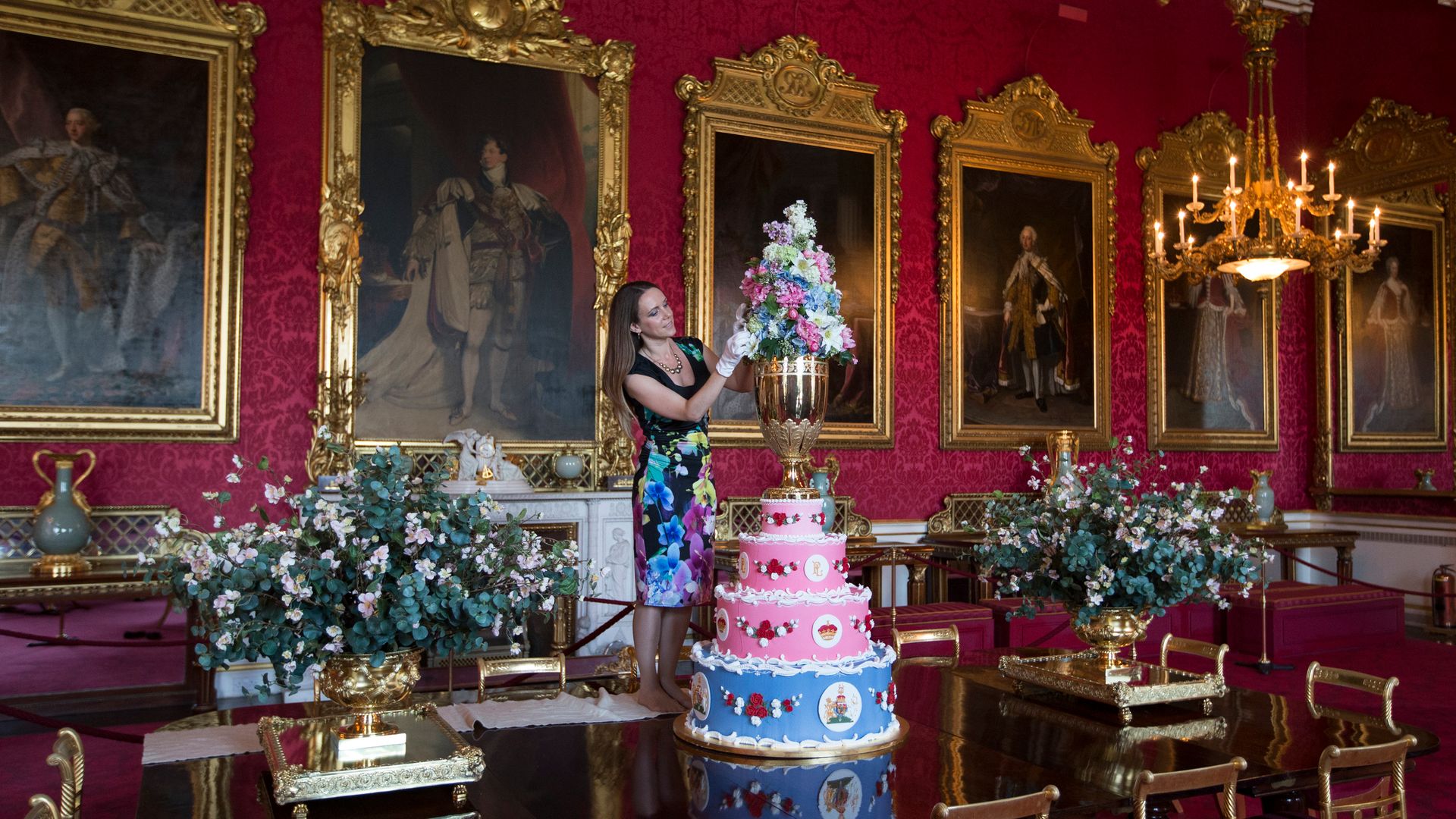 A woman decorating a cake inside the State Dining Room