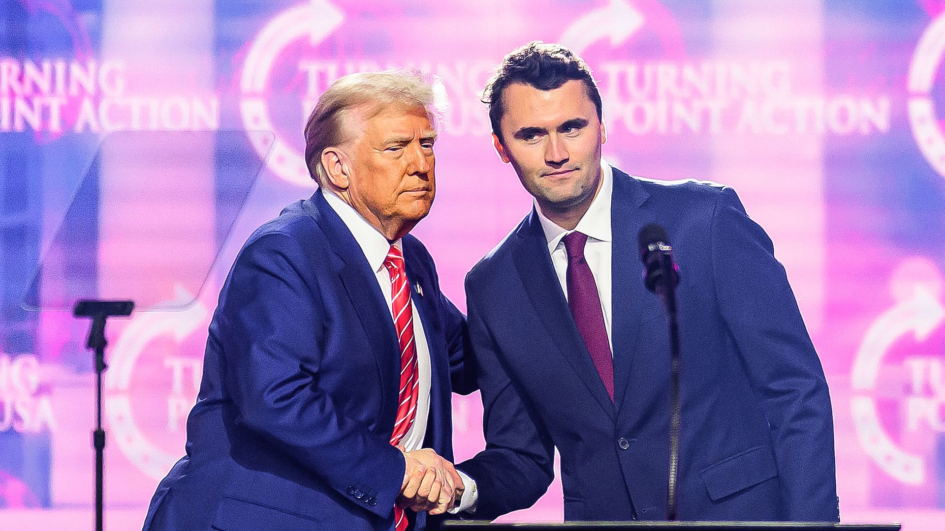 Donald Trump shakes hands with Charlie Kirk