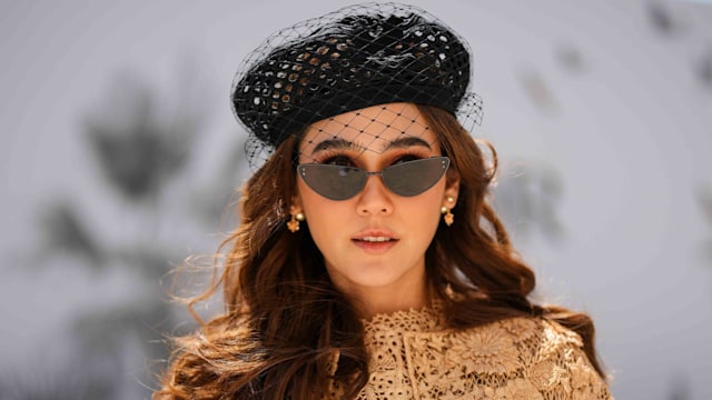 Araya Hargate wears a black wicker with embroidered mesh beret from Dior