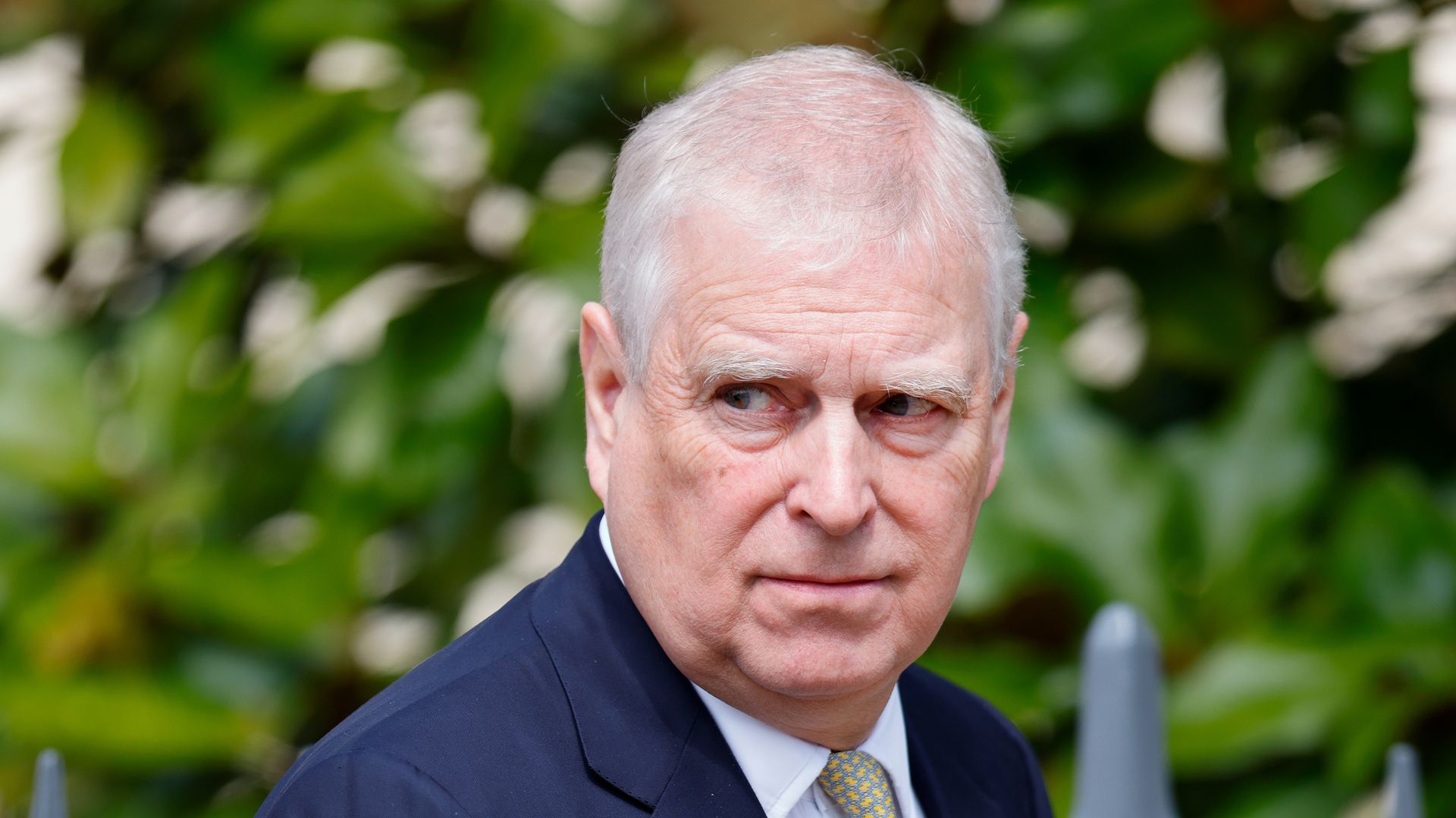 Prince Andrew looking to right in suit