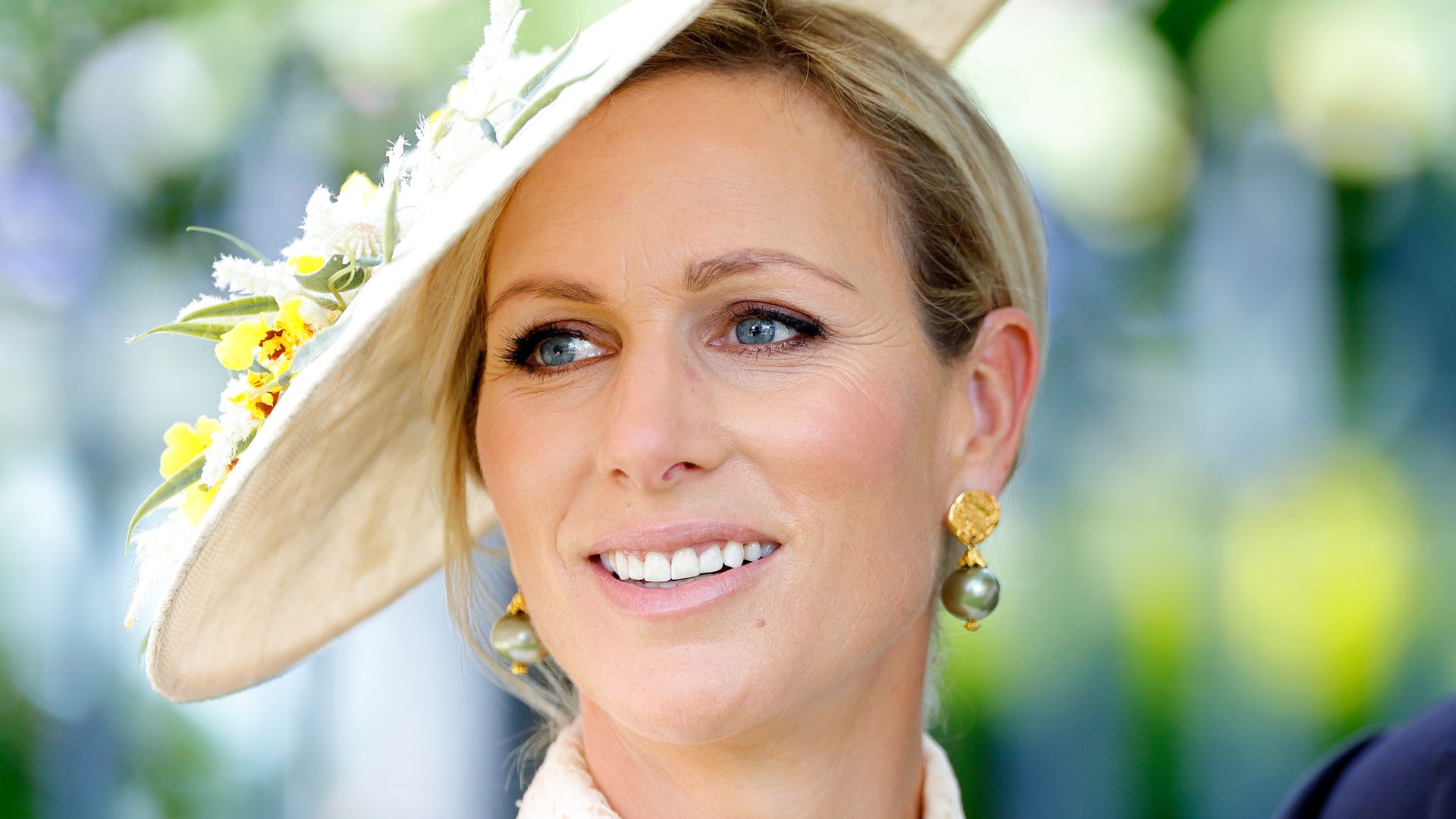 Zara Tindall in white dress and hat