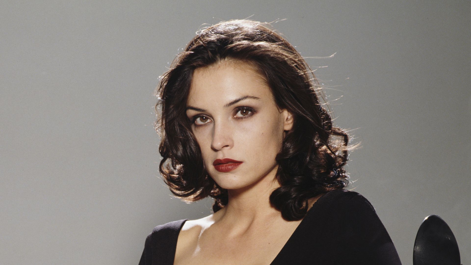 Bond girl, 61, looks like a goddess in daringly low-cut seafoam green dress with sheer tulle skirt